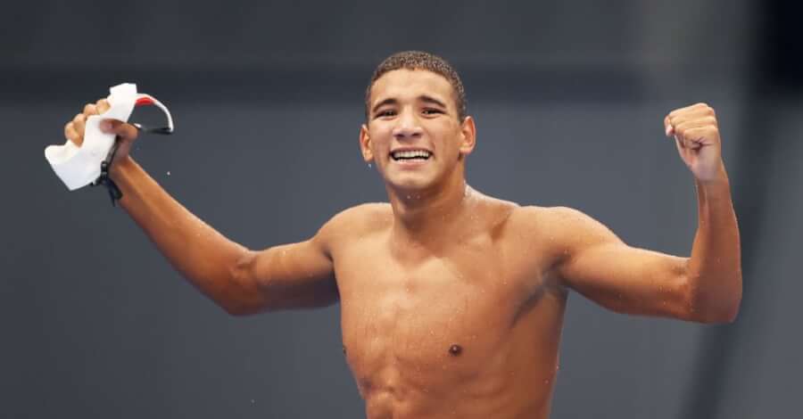 TOKYO, JAPAN - JULY 25: Ahmed Hafnaoui of Team Tunisia celebrates after winning gold in the Men's 400m Freestyle Final on day two of the Tokyo 2020 Olympic Games at Tokyo Aquatics Centre on July 25, 2021 in Tokyo, Japan. Photo by Al Bello | Getty Imag