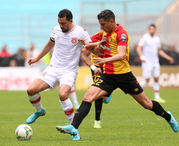 Amamou vying for the ball with Msakni. Photo | BackpagePix